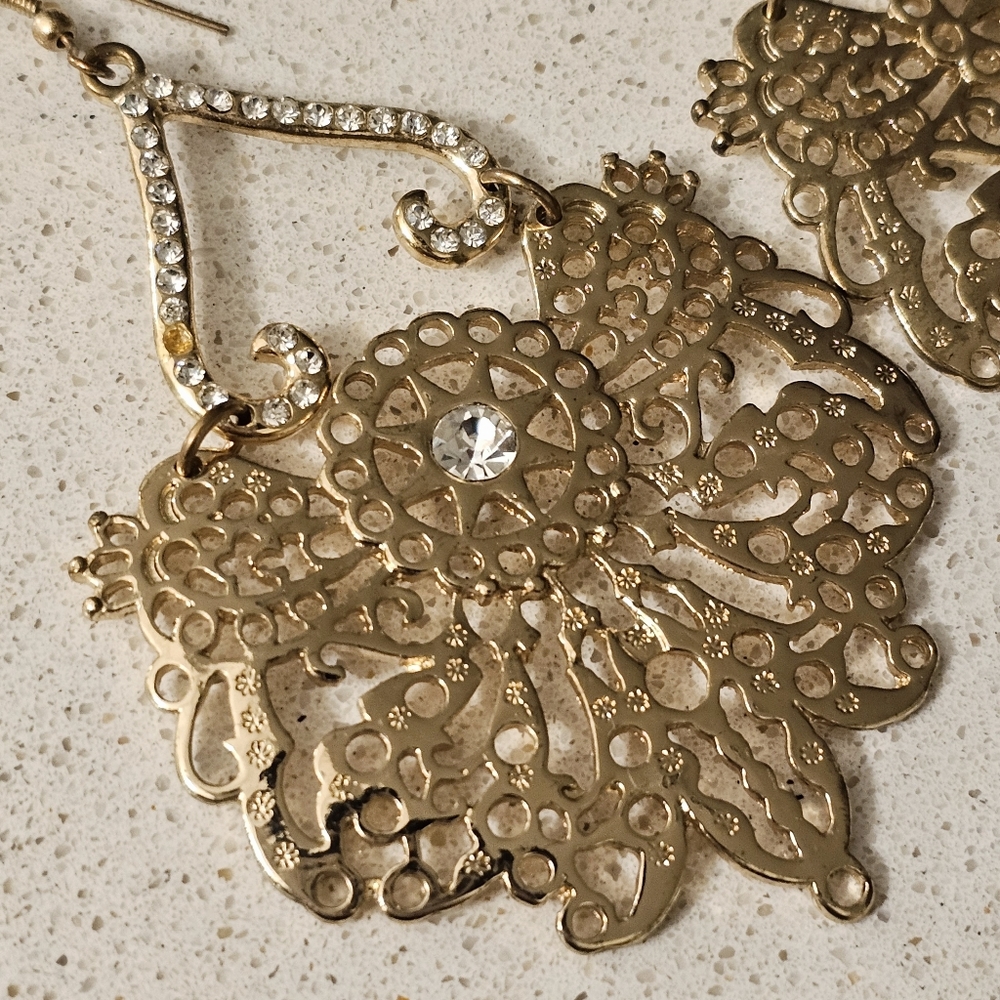 Bebe gold tone chandelier statement earrings